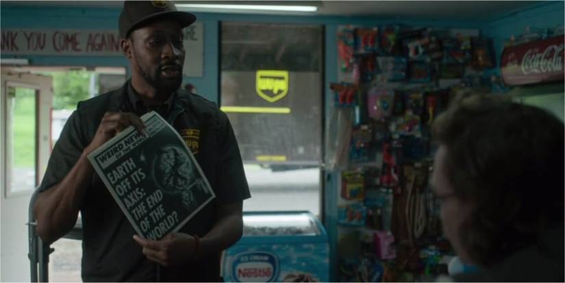 Dean holding a newspaper
