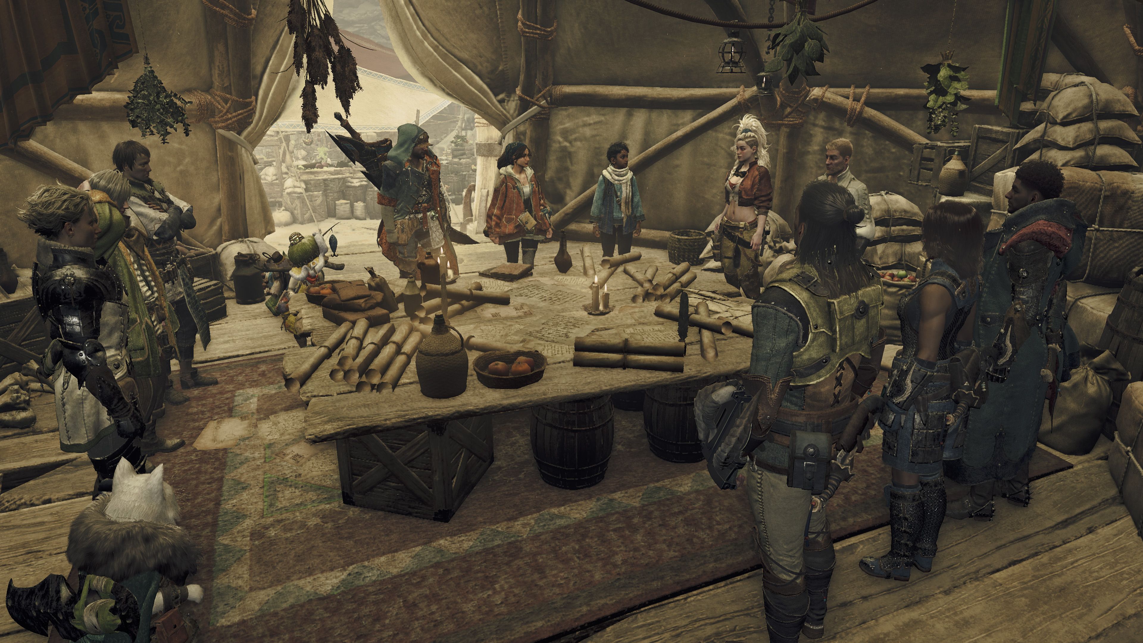 Monster Hunter Wilds base camp showing a group around a table in a tent plotting their next move.