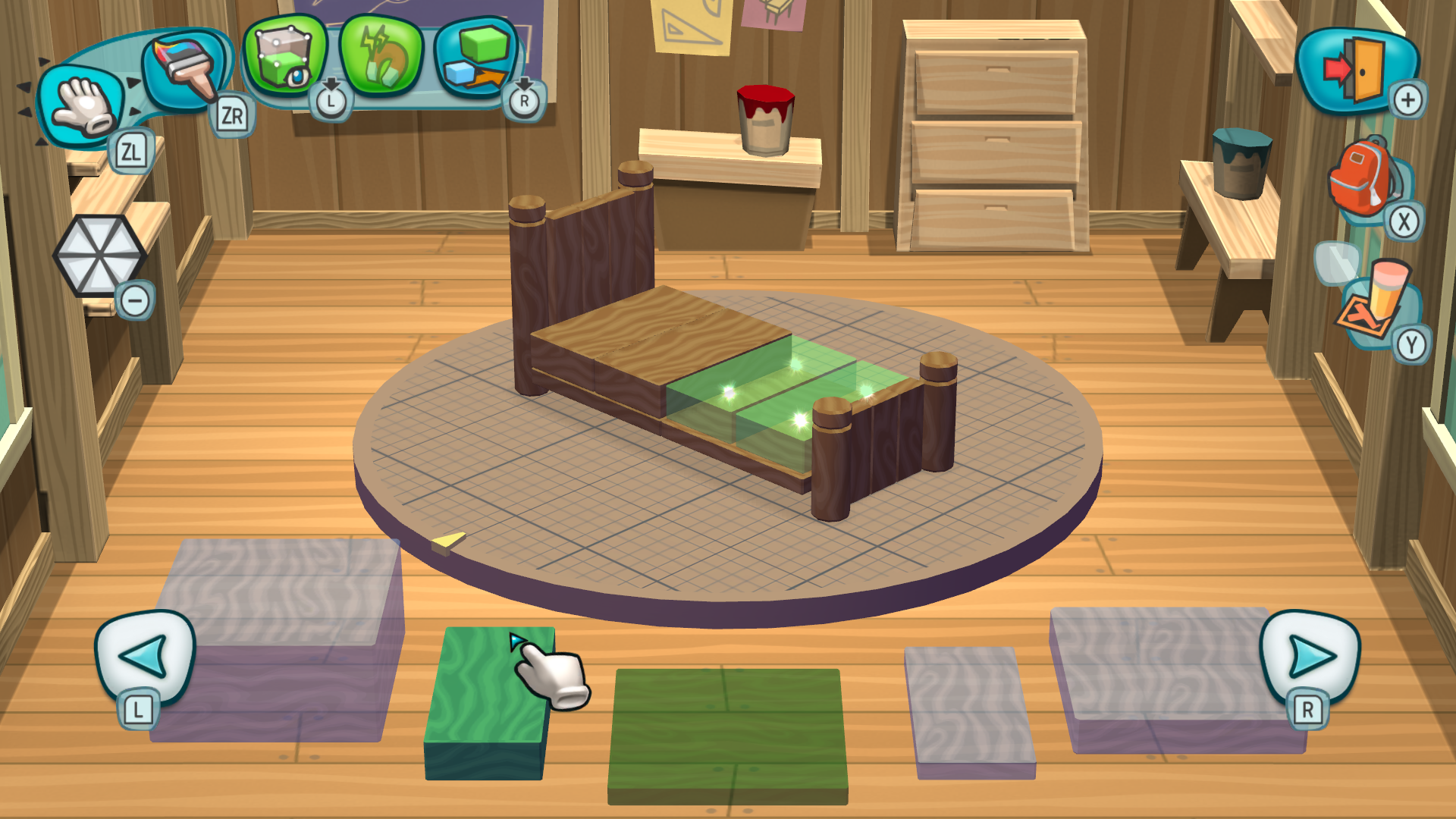 MySims workshop building screen showing a bed in progress, with two green spaces showing where the final blocks need to go.