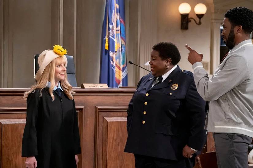Judge Abby Stone (Melissa Rauch) shows up to court with a straw hat with a big sunflower on it as