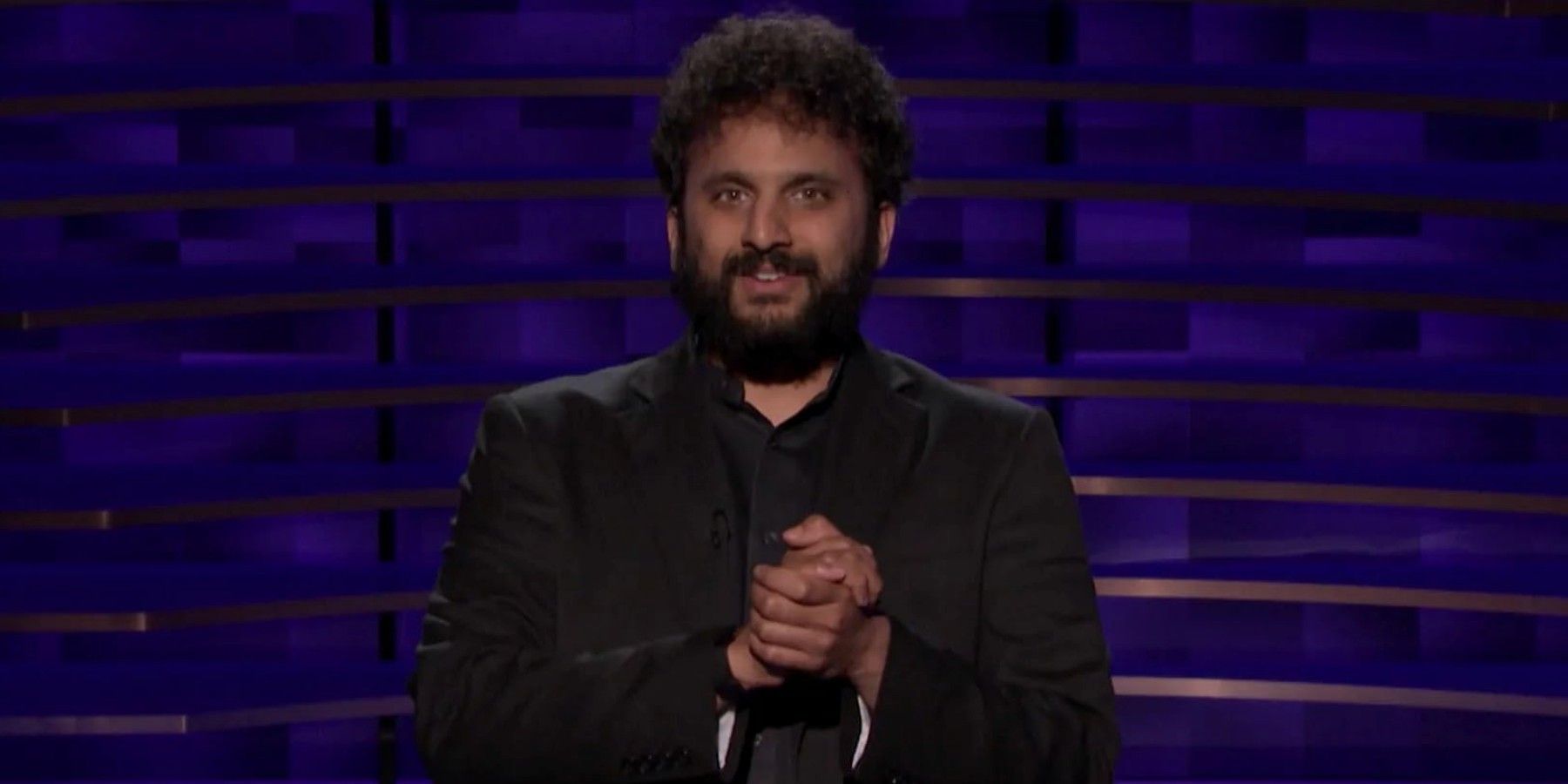 Nish Kumar performing on stage 