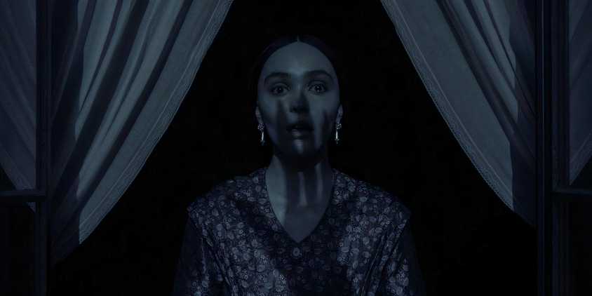 Nosferatu image of woman standing at window