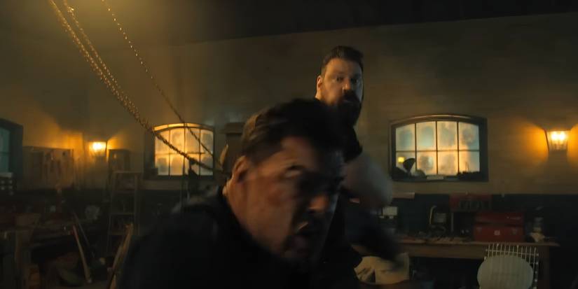 Olivier Richters as Paulie punching Alan Ritchson as Reacher