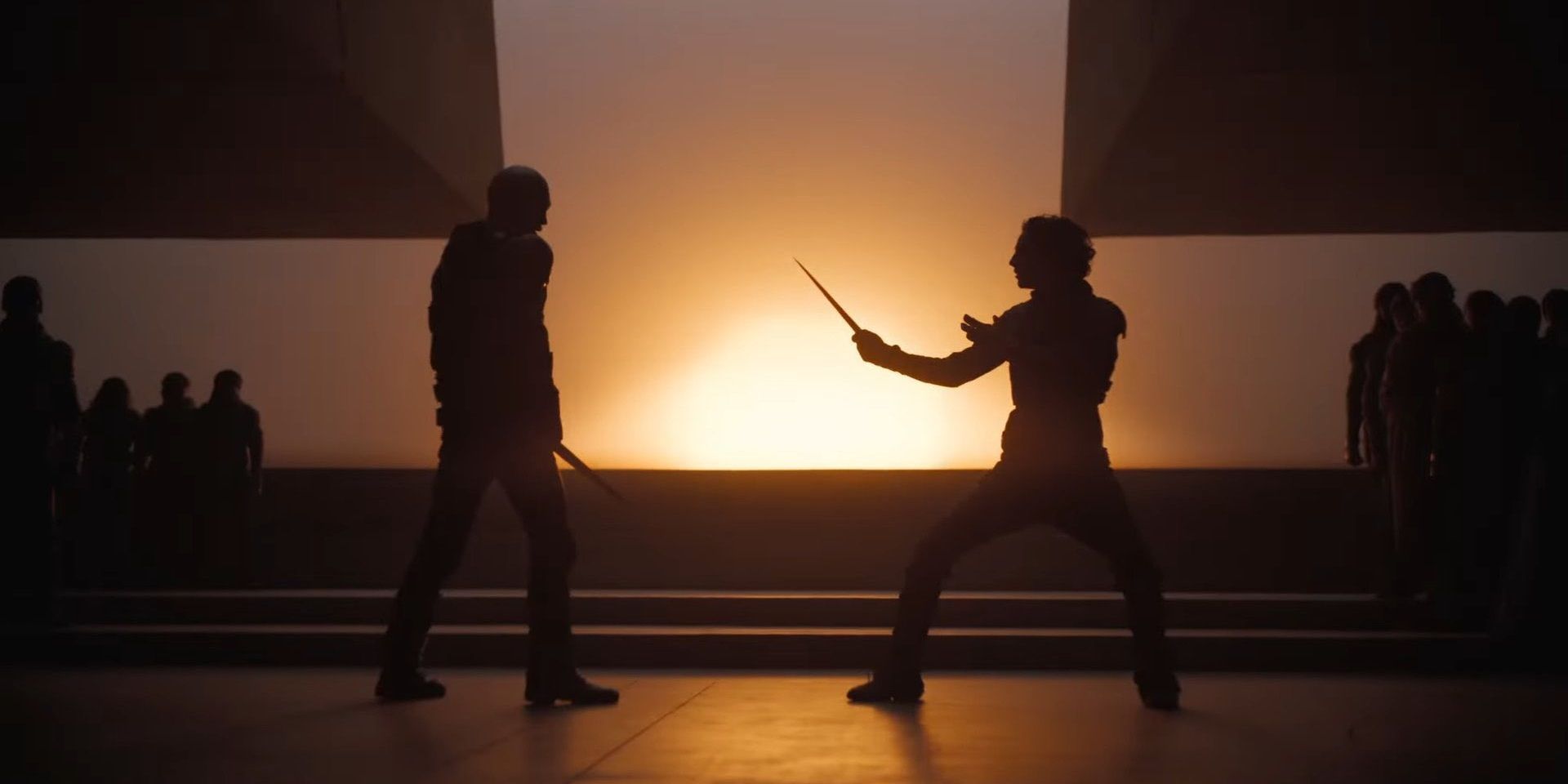 Paul and Feyd-Rautha prepare to fight with knives in Dune Part Two