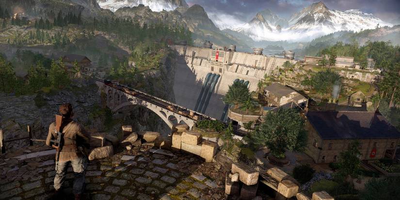 Player Standing On A Building With A Gun On His Back In Sniper Elite Resistance.