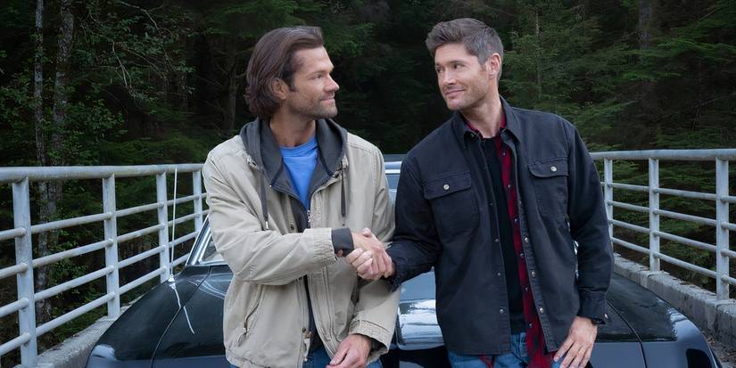 Sam and Dean shaking hands in Supernatural season 15, episode 20, Carry On