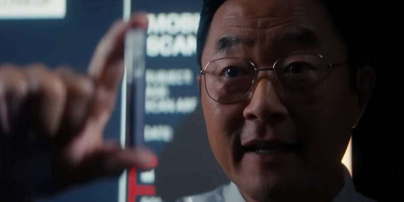 Stephen Park holding up a vial in Death of a Unicorn.