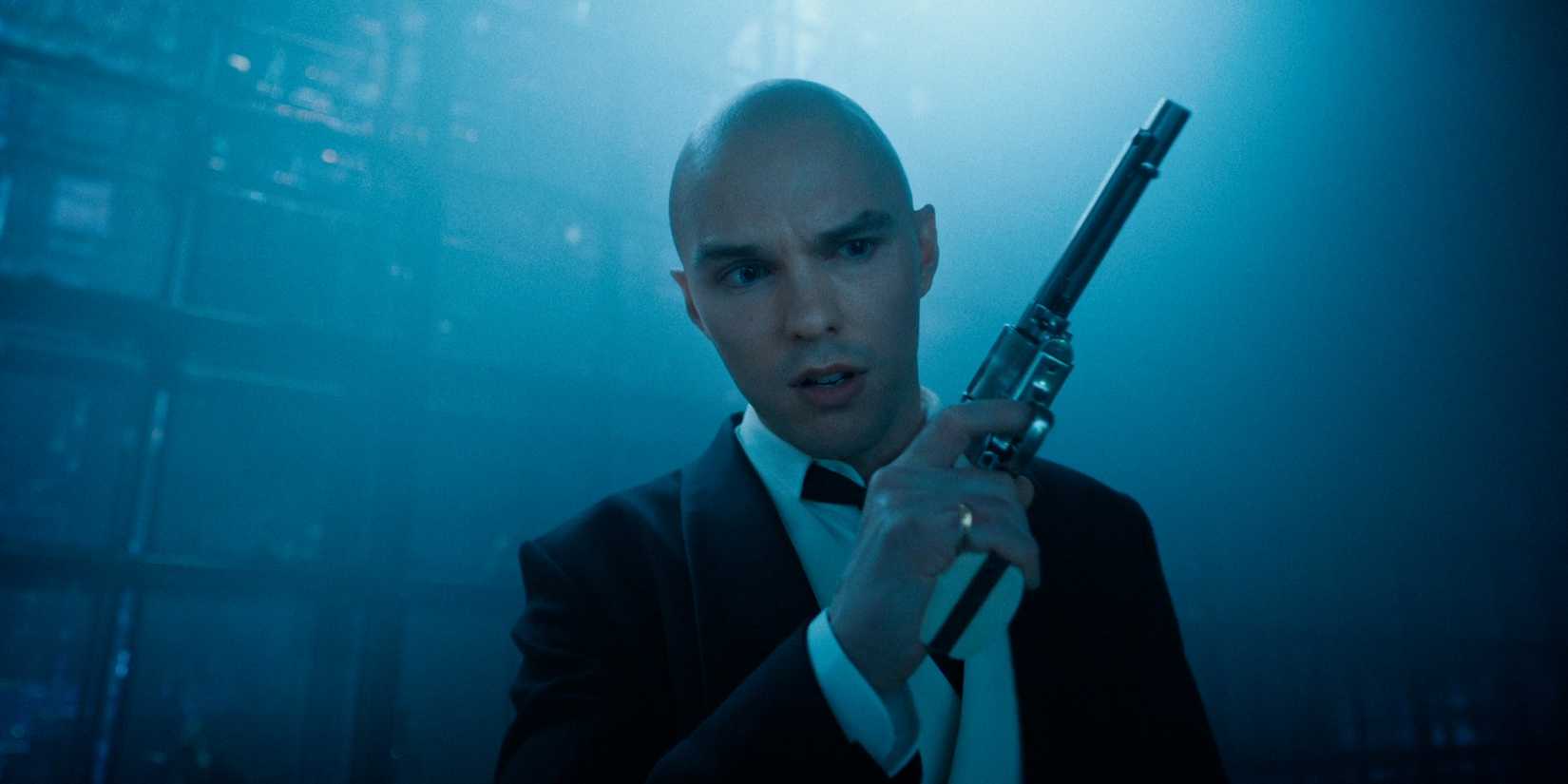 Nicholas Hoult as Lex Luthor holds a gun in the trailer for Superman