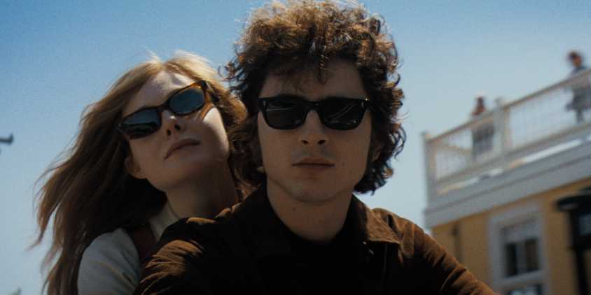 Sylvie rides on Bob Dylan's motorcyle in a Complete Unknown
