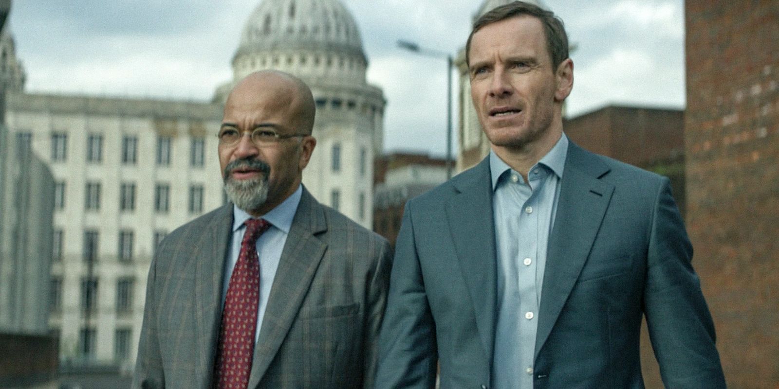 Jeffrey Wright and Michael Fassbender walk together in The Agency