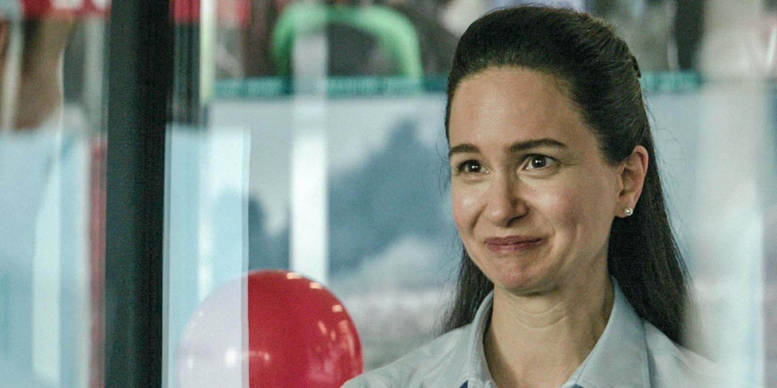 Katherine Waterston smiles in The Agency