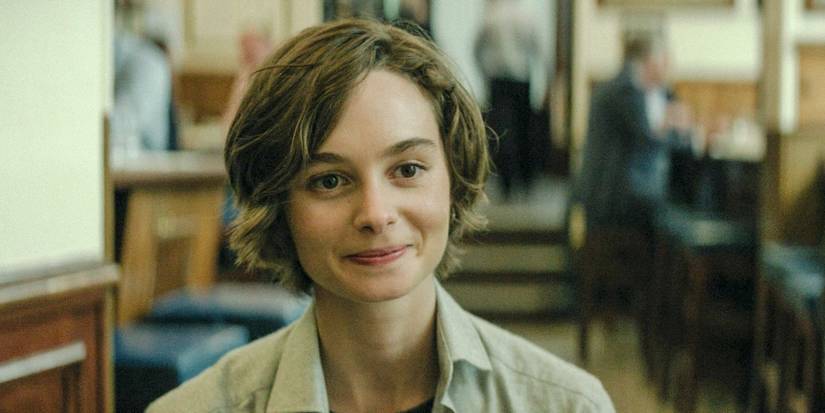 A young student smiling in The Agency season 1 