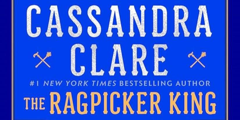 The Ragpicker King cover featuring a blue background, the title text in yellow, and Cassandra Clare's name in white
