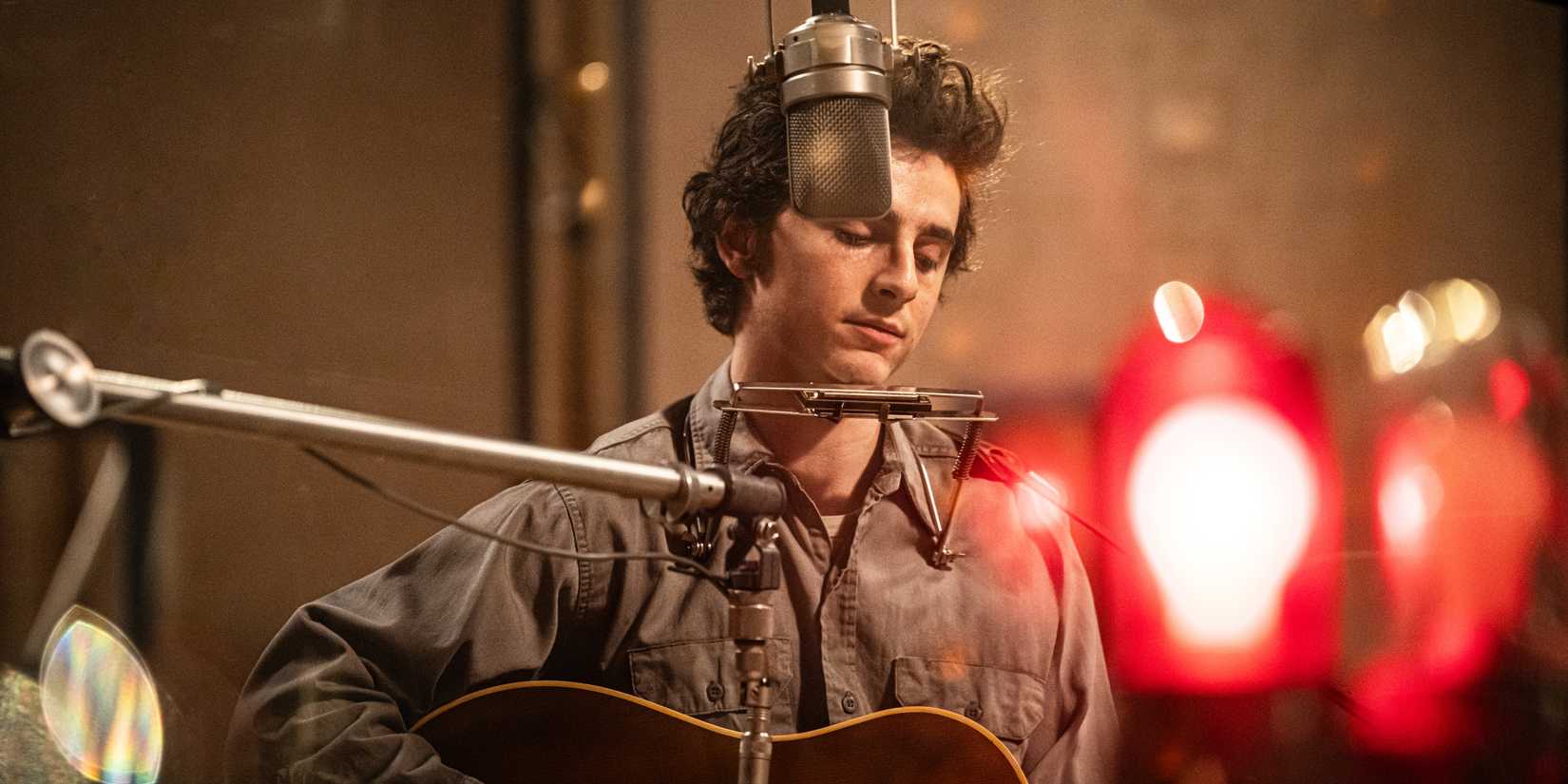 Timothee Chalamet as Bob Dylan recording music in A Complete Unknown