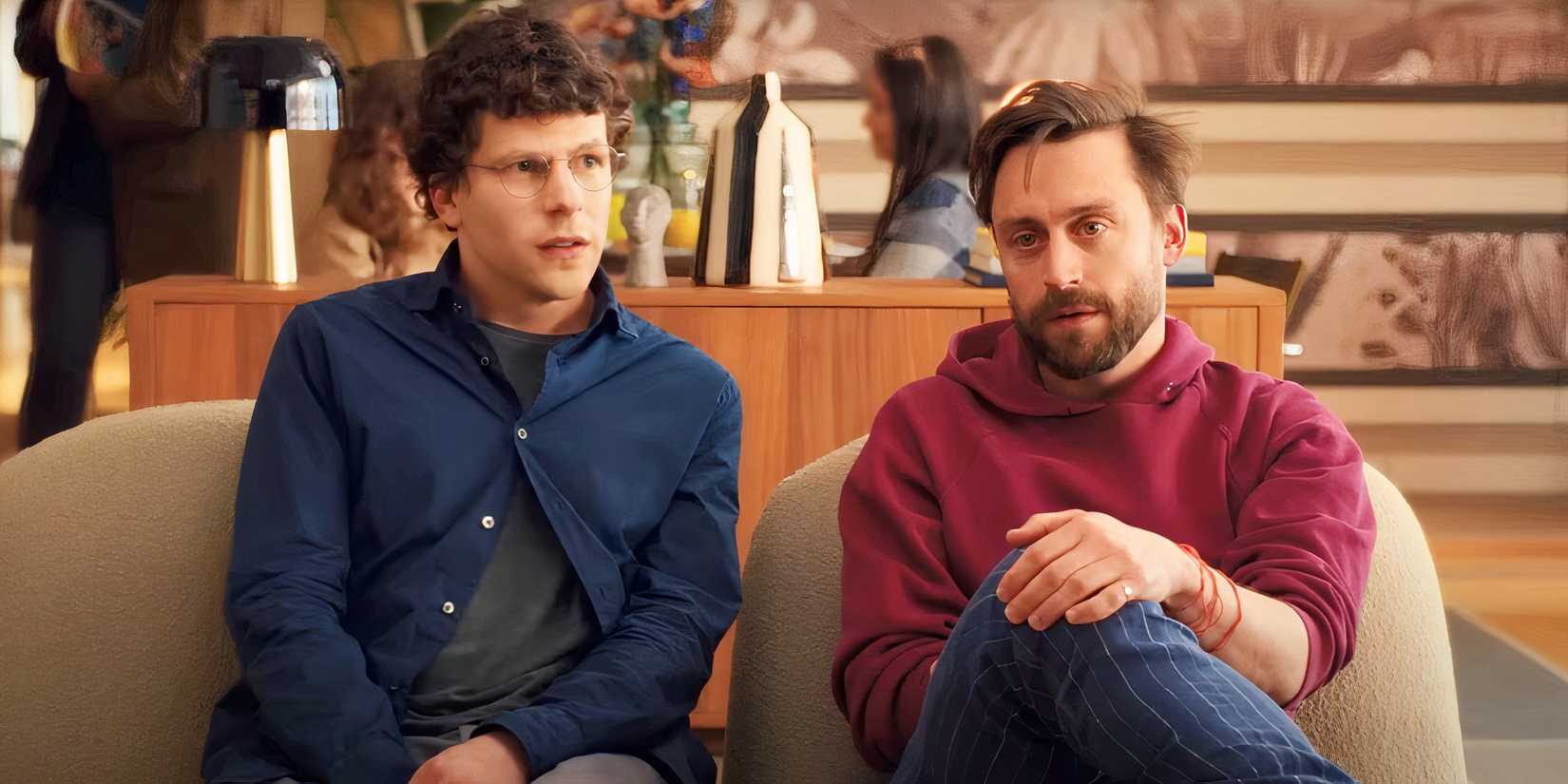 Jesse Eisenberg & Kieran Culkin sitting in the lobby in A Real Pain
