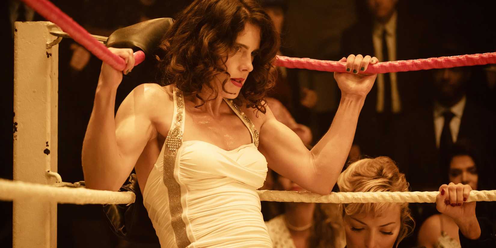 Emily Bett Rickards as Mildred Burke leaning back against the ropes in Queen of the Ring