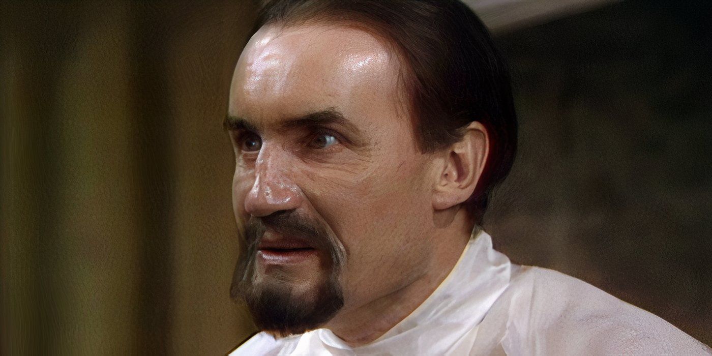 Anthony Ainley as The Master looking at something off-screen in the Doctor Who serial Castrovalva.