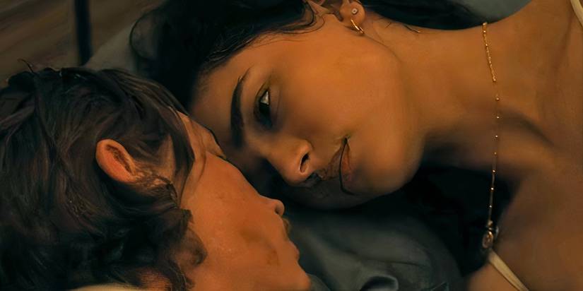 Cooper and Ariana face each other on the bed in Landman.