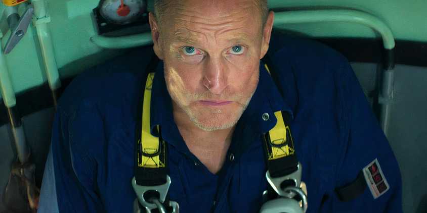 Woody Harrelson looking up concerned in Last Breath