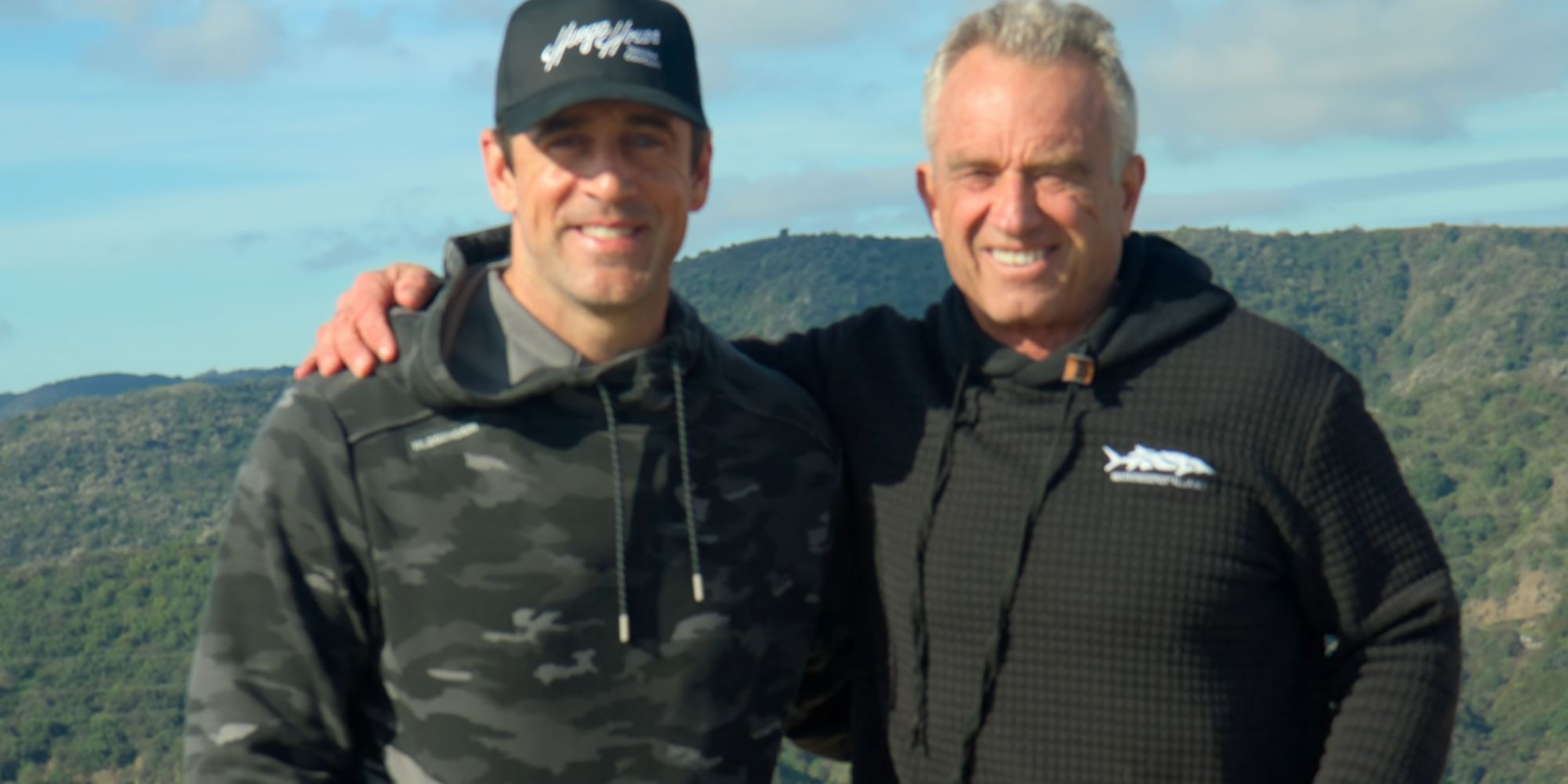 Aaron Rodgers and Robert F. Kennedy Jr. posing for a photo together in Aaron Rodgers: Enigma