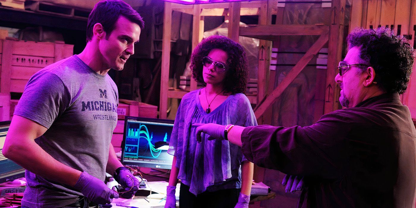 Warehouse 13 Season 3 Full cast in a purple coloured room Artie Nielsen, Myka Bering and Pete Lattimer