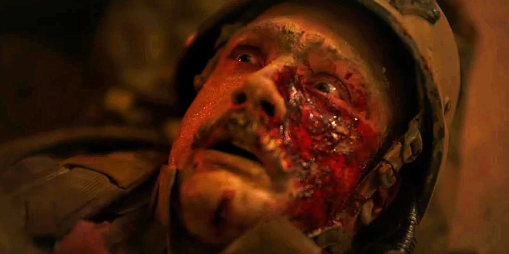 Warfare Trailer man with bloody face looking up in shock 
