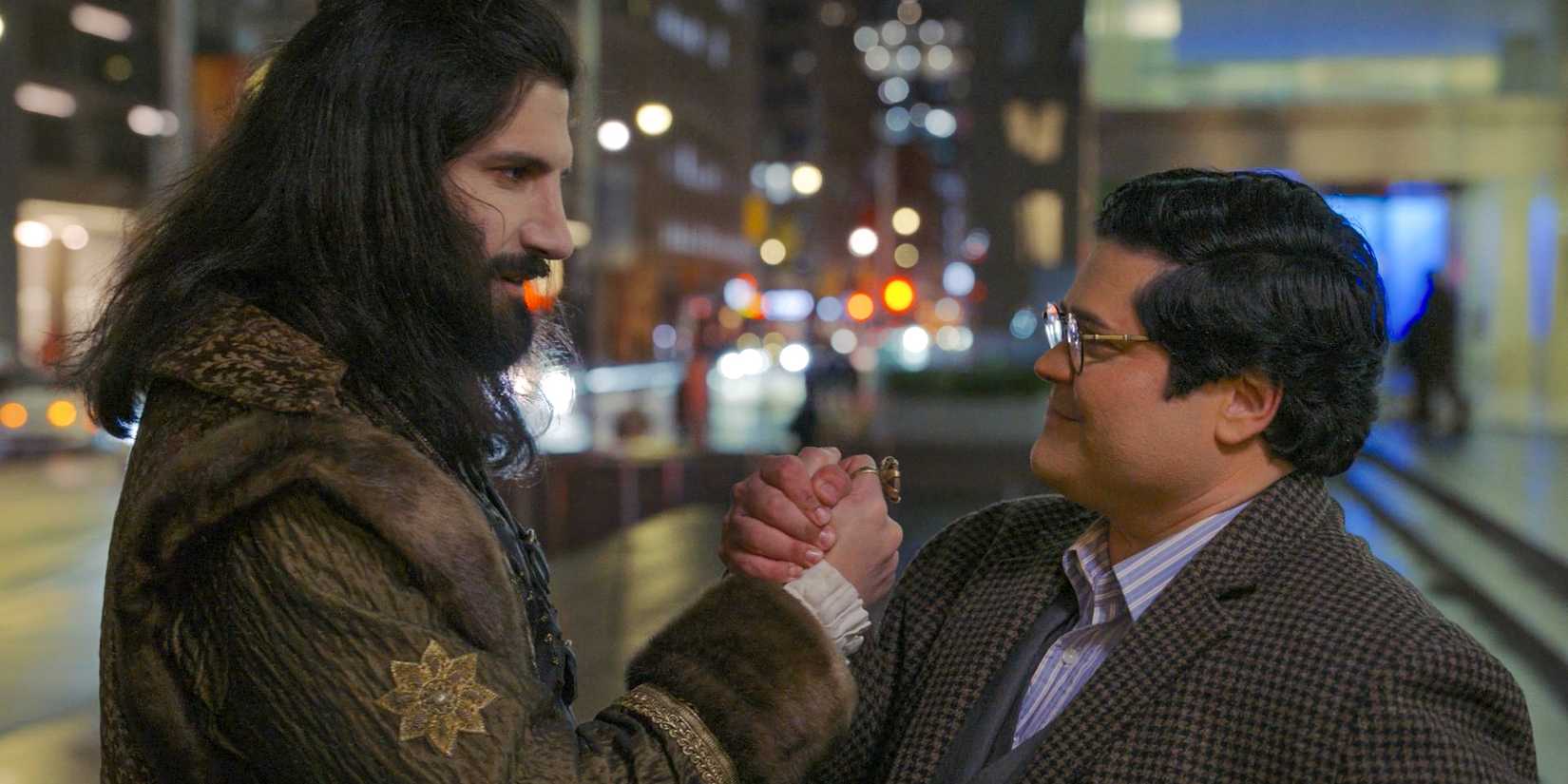 Nandor (Kayvan Novak) and Guillermo (Harvey Guillén) shake hands and make an alliance in What We Do in the Shadows Season 6 Ep 10