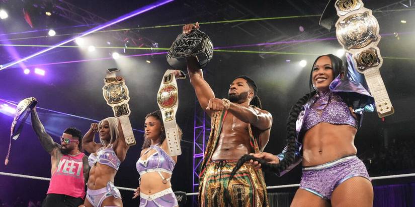 WWE Intercontinental Champion Jey Uso, Women's Tag Team Champions Jade Cargill and Bianca Belair, North American Champion Kehlani Jordan, and NXT Champion Trick Williams pose in the ring together