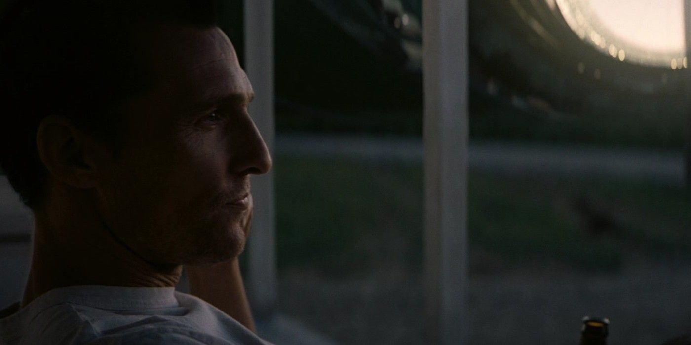 Matthew McConaughey as Cooper sitting on his recreated farm in Interstellar