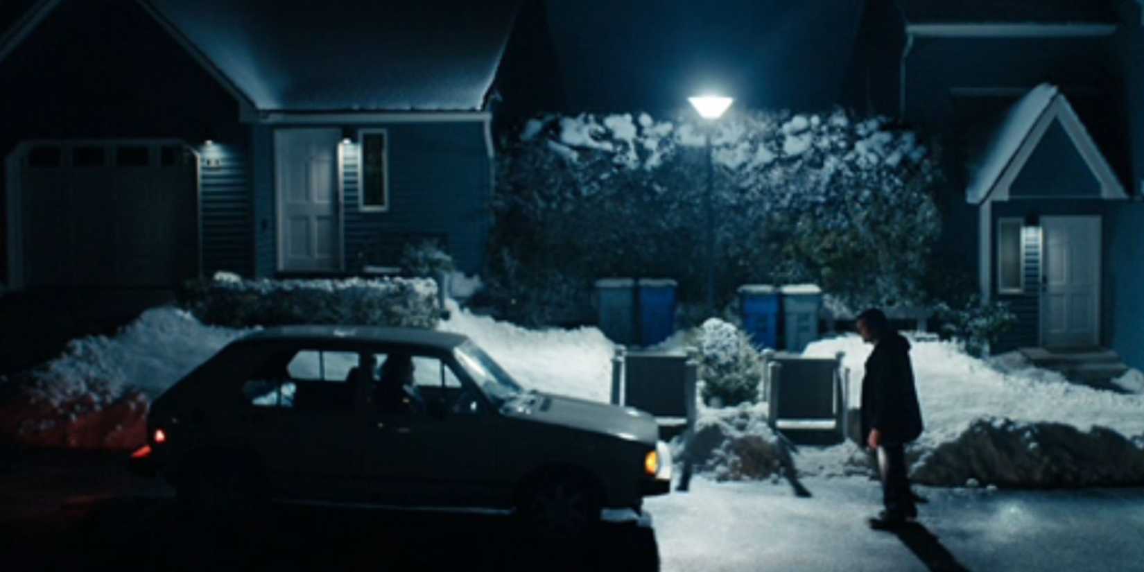 Mark stopping Ms. Cobel's car from driving away in Severance