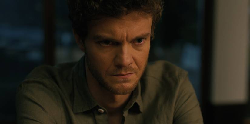 A close-up of Jack Quaid as Josh with a dark expression on his face in Companion