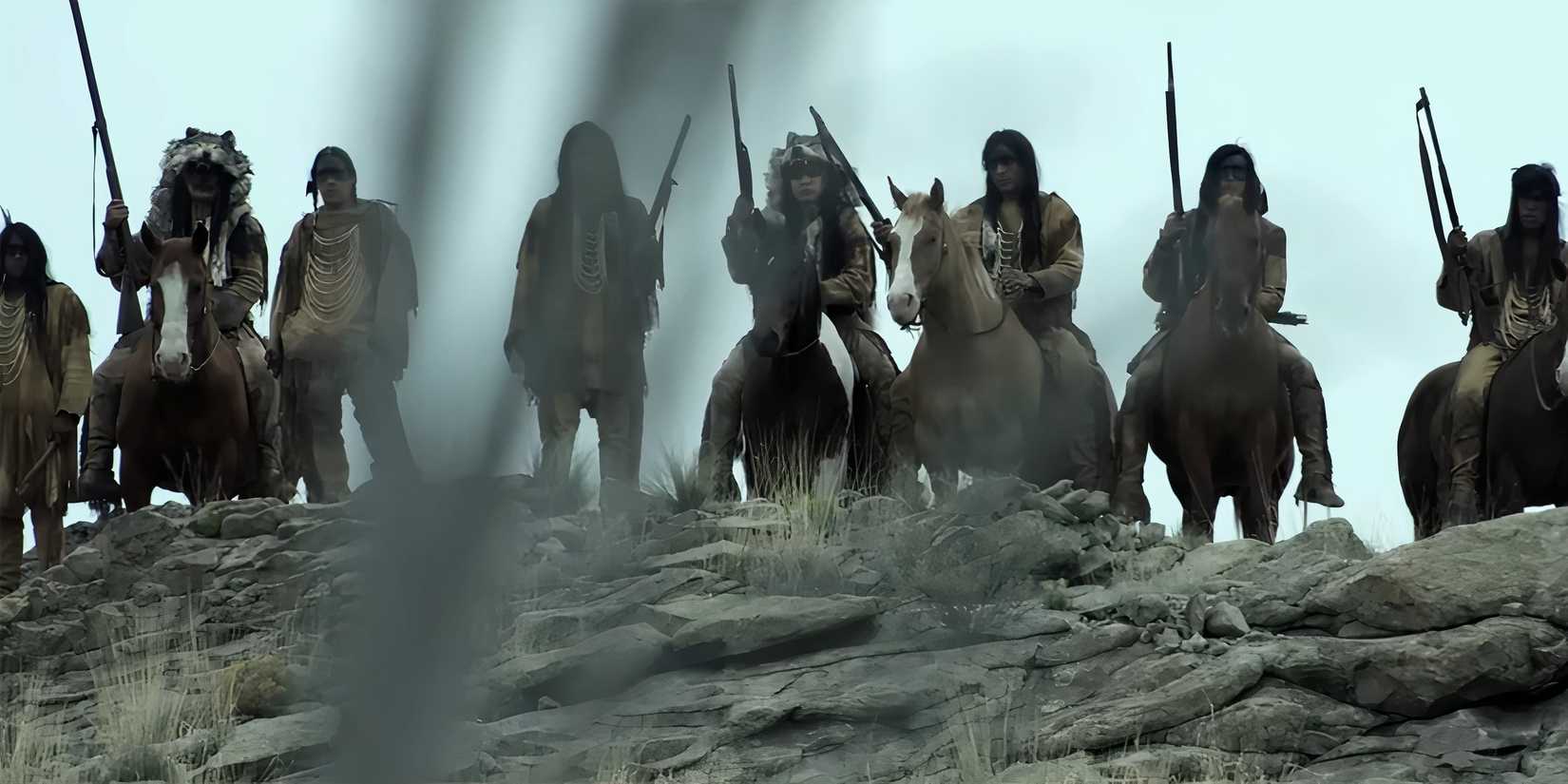 A group of Native Americans standing on a hillside looking battle ready in American Primeval