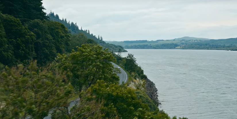 A lake is next to a road in Missing You