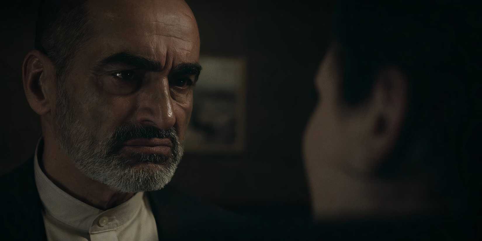 Abbas (Navid Nagahban) staring intensely at Noor (Arienne Mandi) in The Night Agent