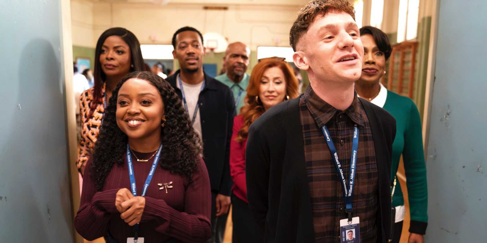 Ava Coleman (Janelle James), Janine Teagues (Quinta Brunson), Gregory Eddie (Tyler James Williams), Mr. Johnson (William Stanford Davis), Melissa Schemmenti (Lisa Ann Walter), Jacob Hill (Chris Perfetti), and Barbara Howard (Sheryl Lee Ralph) walking out of the gymnasium together in Abbott Elementary. 