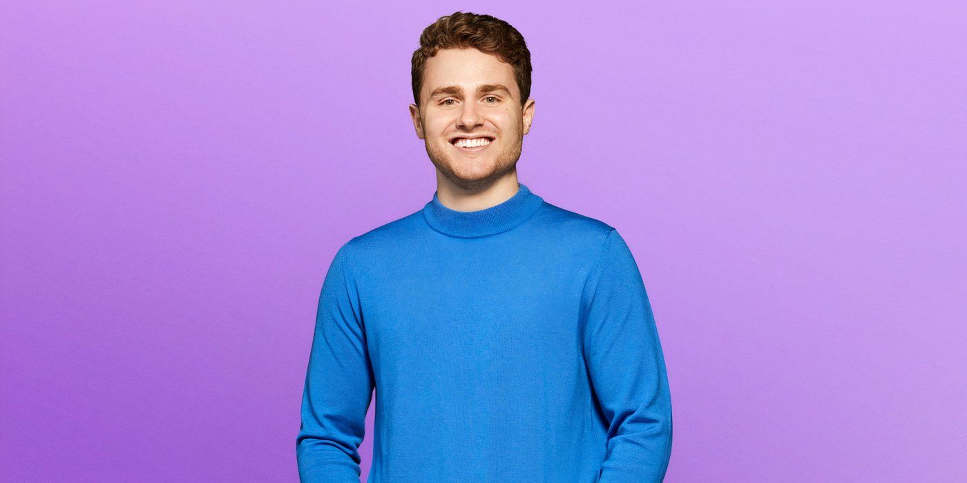 Love is Blind Season 8 Alex Brown smiling during a promotional photo with a purple background