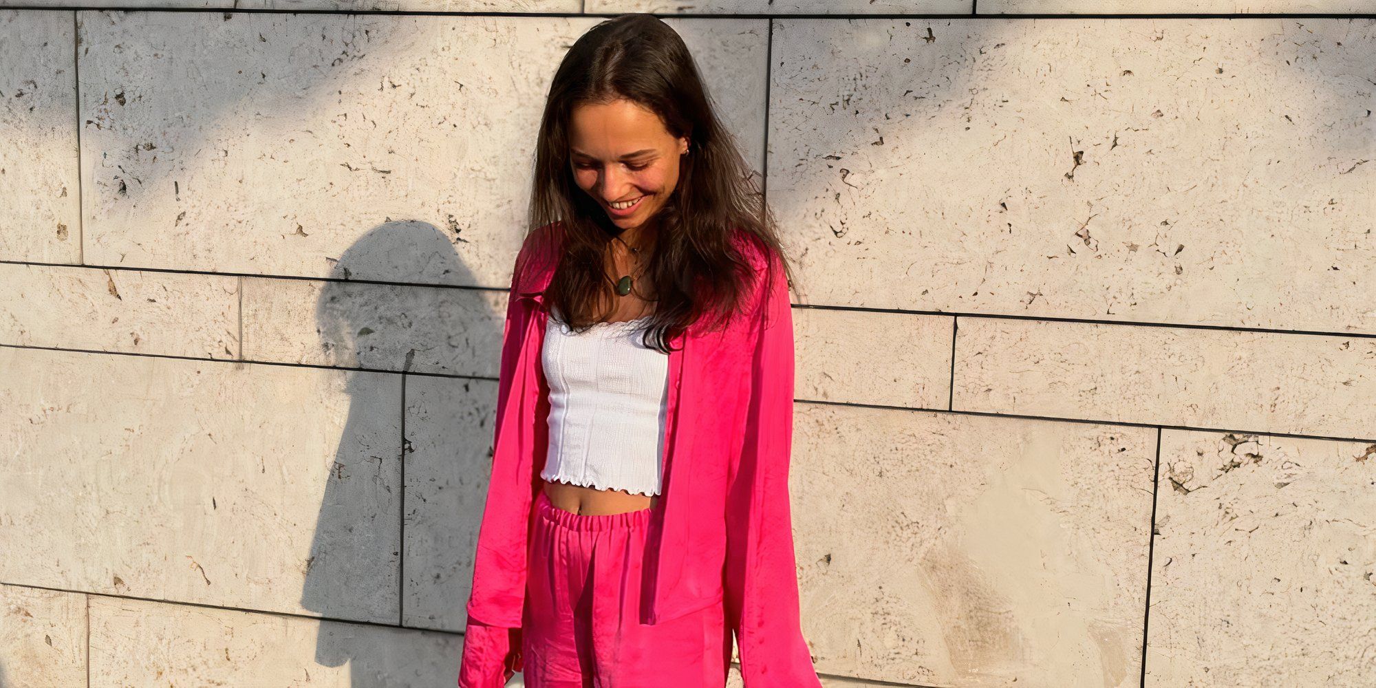 Love Is Blind: Germany season 1 Alina Rothbauer in a pink outfit while looking down