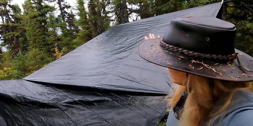alone season 9 contestant at tent