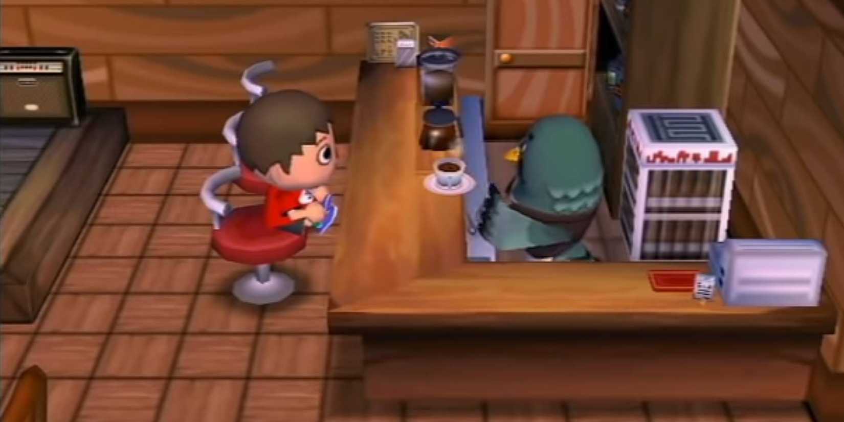 The player sat at Brewster's cafe in Animal Crossing City Folk.