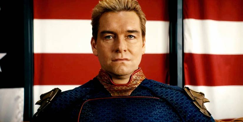 Antony Starr as Homelander seething in front of the American flag in The Boys.