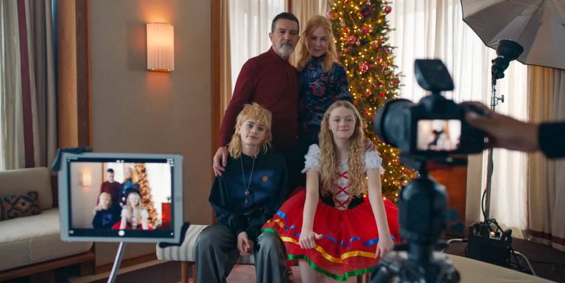 Christmas photo session of Jacob (Antonio Banderas), Romy (Nicole Kidman), and their daughters in Babygirl (2024)