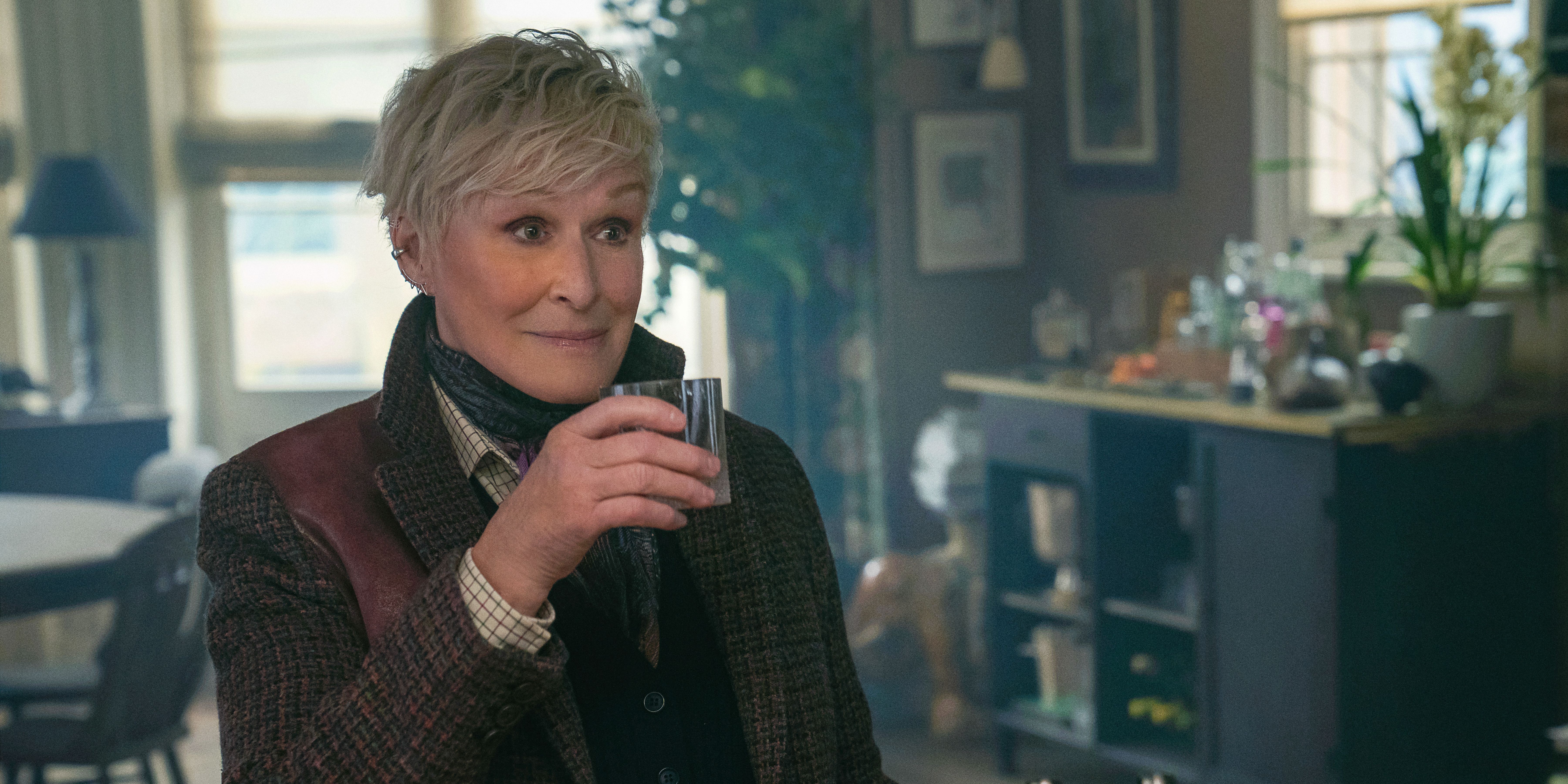 Ginny (Glenn Close) holding a glass in Back in Action