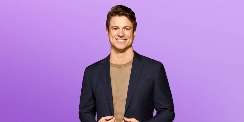 Love is blind season 8 Ben Mezzenga in a suit smiling during the show's promo shoot