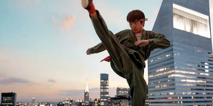 Ben Wang as Li Fong doing a high kick in Karate Kid: Legends (2025)