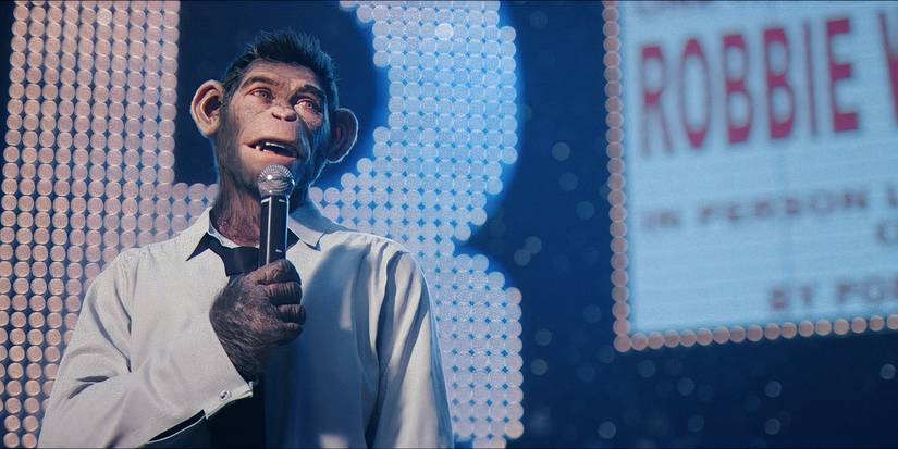 Robbie Williams performing at a concert in Better Man