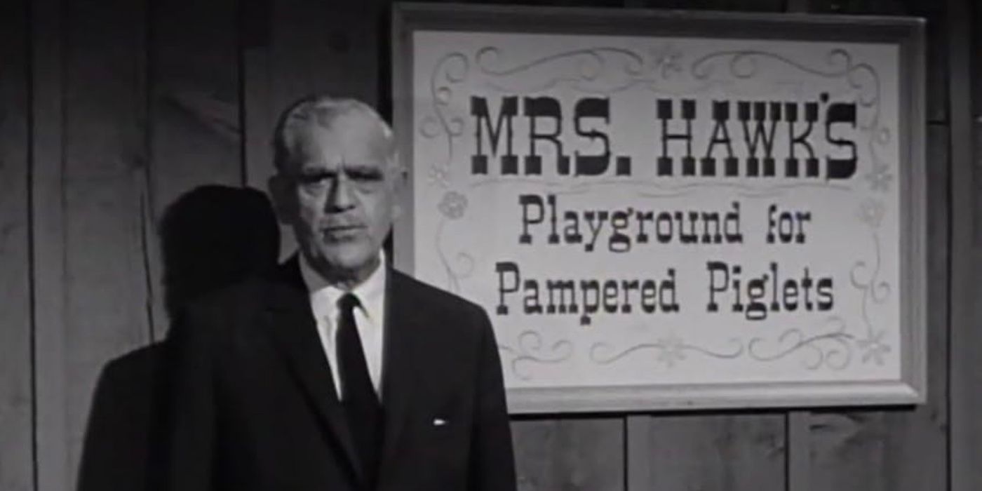 Boris Karloff stands sternly in front of a sign that reads, "Mrs. Hawk's Playground for Pampered Piglets."