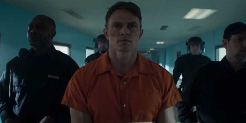 Benjamin Dex Poindexter being escorted in cuffs by soldiers in Daredevil Born Again