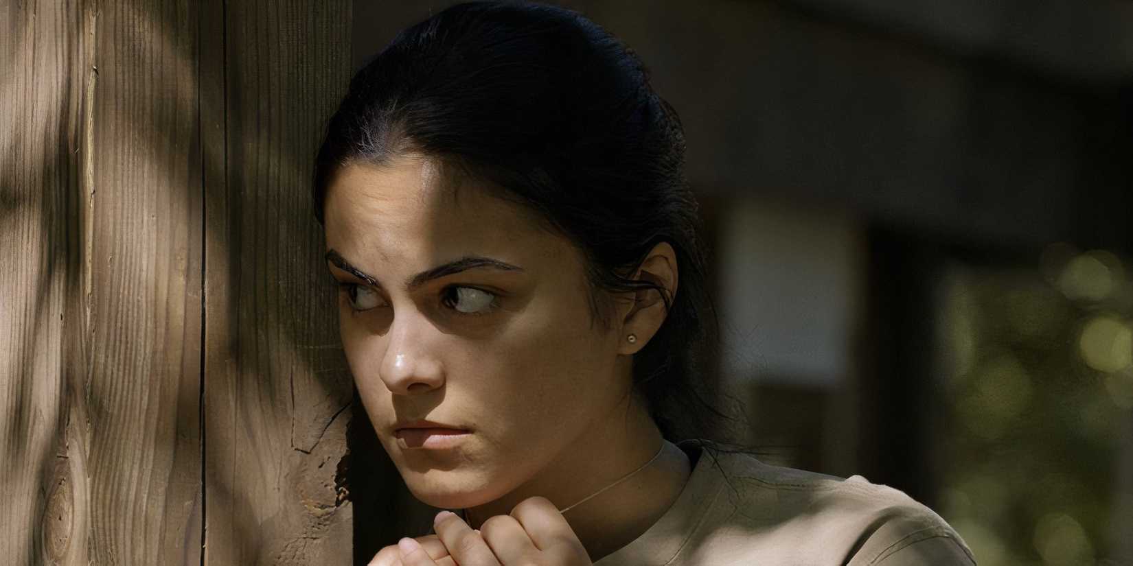 Camila Mendes hiding behind a corner in Coyote Lake