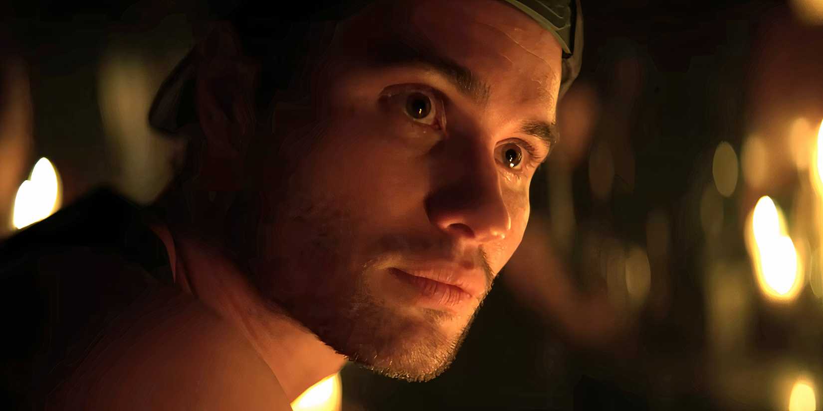 Chase Stokes as Rule looking seriously while at a bar in Marked Men: Rule + Shaw