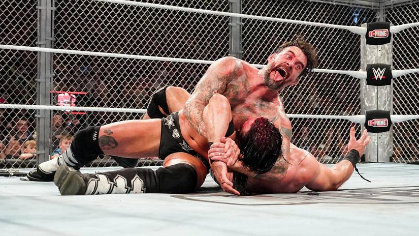 CM Punk locks in the Anaconda Vise on Drew McIntyre at WWE Bad Blood inside the Hell in a Cell